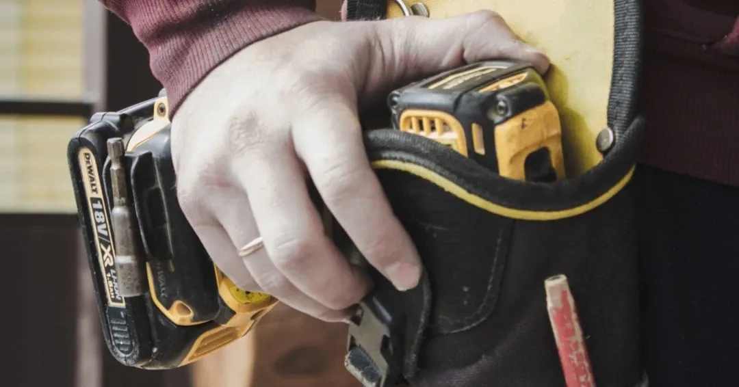 QEI electrician holding drill